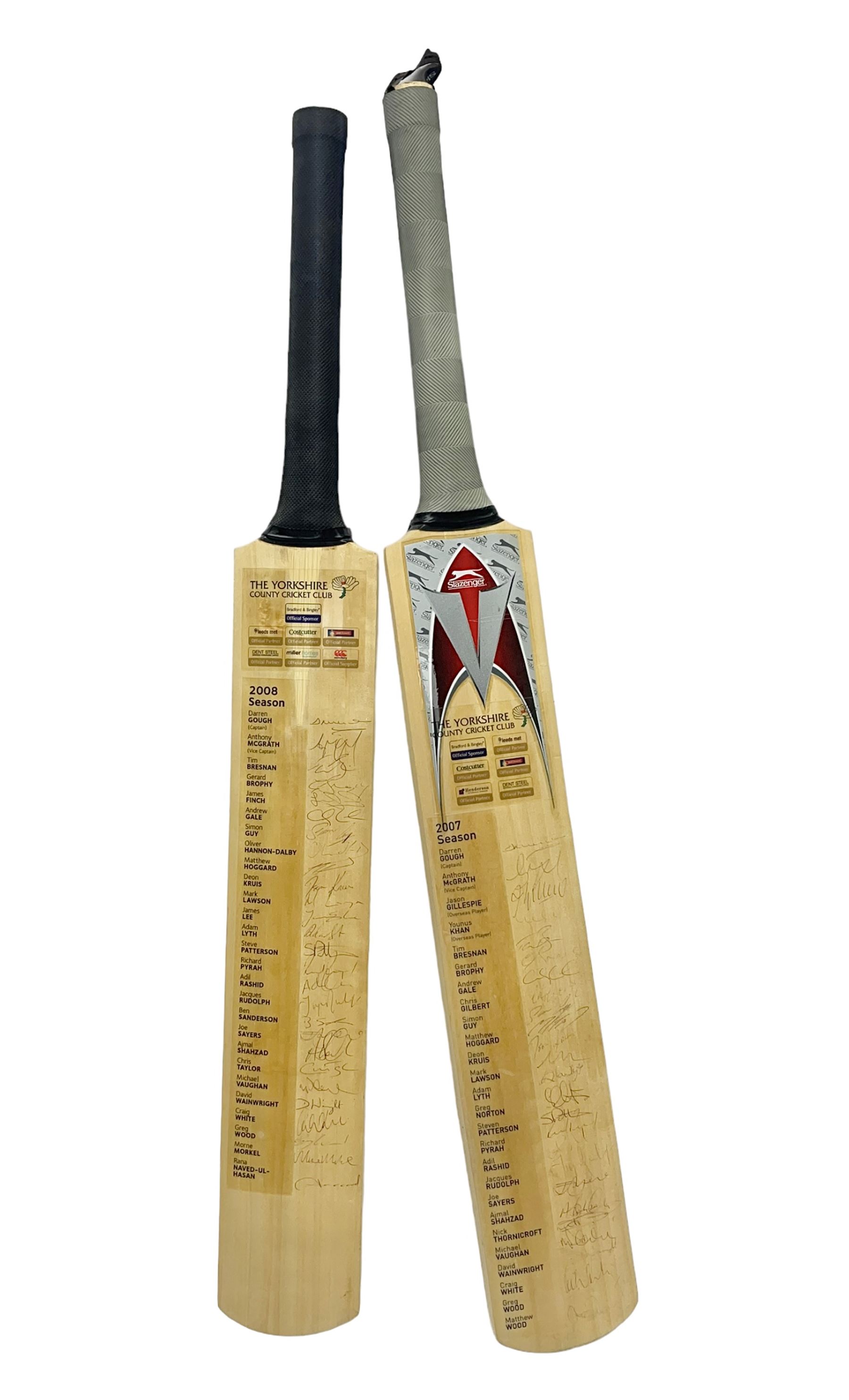 Two signed Yorkshire County cricket bats, from 2007 and 2008 seasons, bearing signatures including Darren Gough, Jason Gillespie, Younus Khan, Michael Vaughn and Tim Bresnan, etc