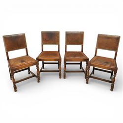 Early 20th century four oak side chairs, with studded leather upholstered backs and seats,...