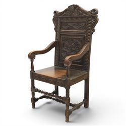 17th century style carved oak Wainscott chair, intricately carved back, united by a turned stretcher