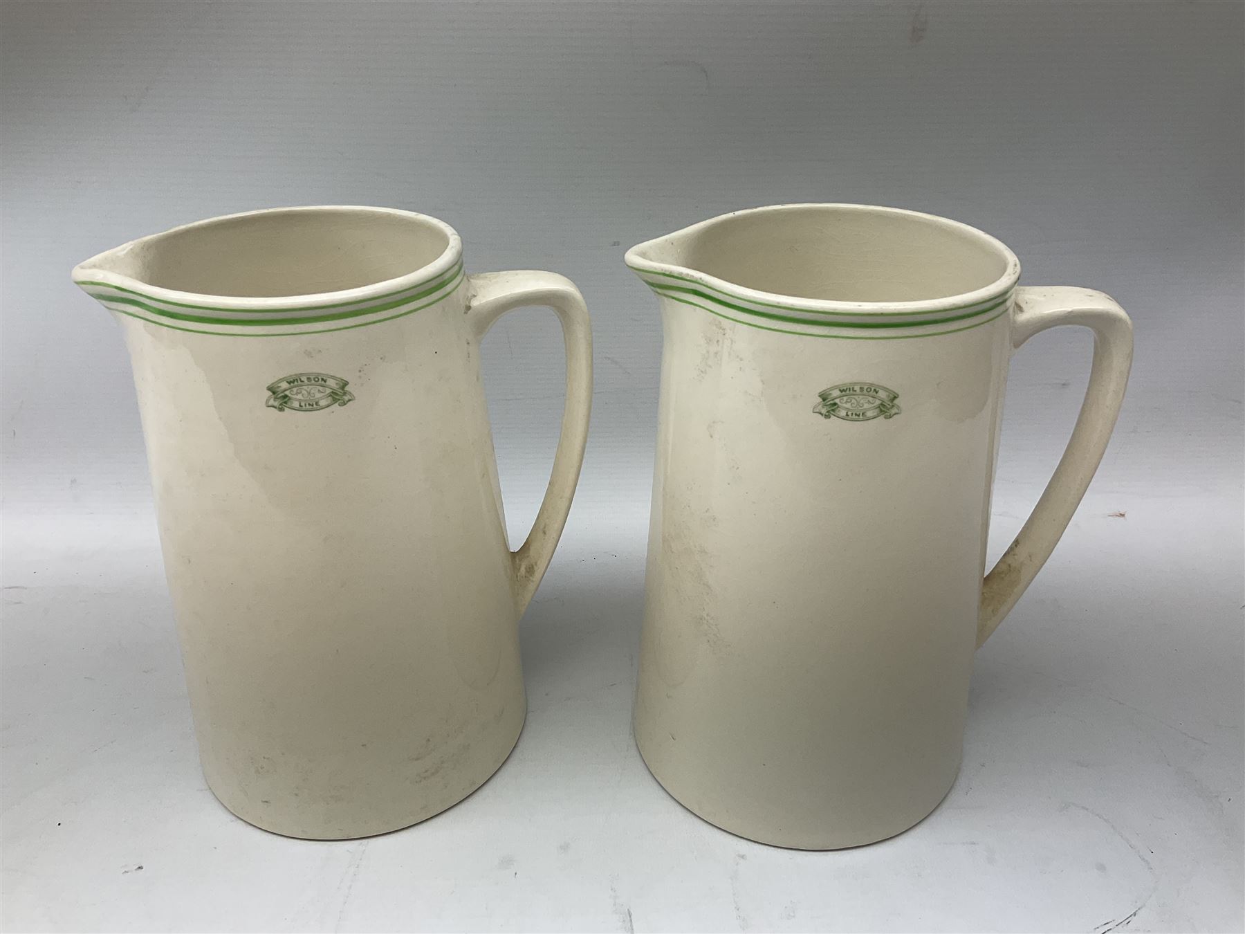 Wilson Line of Hull - five graduated ceramic jugs by Weatherby, Adams and Crown Ducal, largest H22cm, sets of six port and liqueur glasses, four silver plated menu holders and glass ashtray (22)  