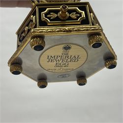 Franklin Mint House of Faberge; The Imperial Jeweled Egg Chess set, the egg opening to reveal a chess board, with a draw to the hexagonal base holding the miniature chess pieces, H23cm 