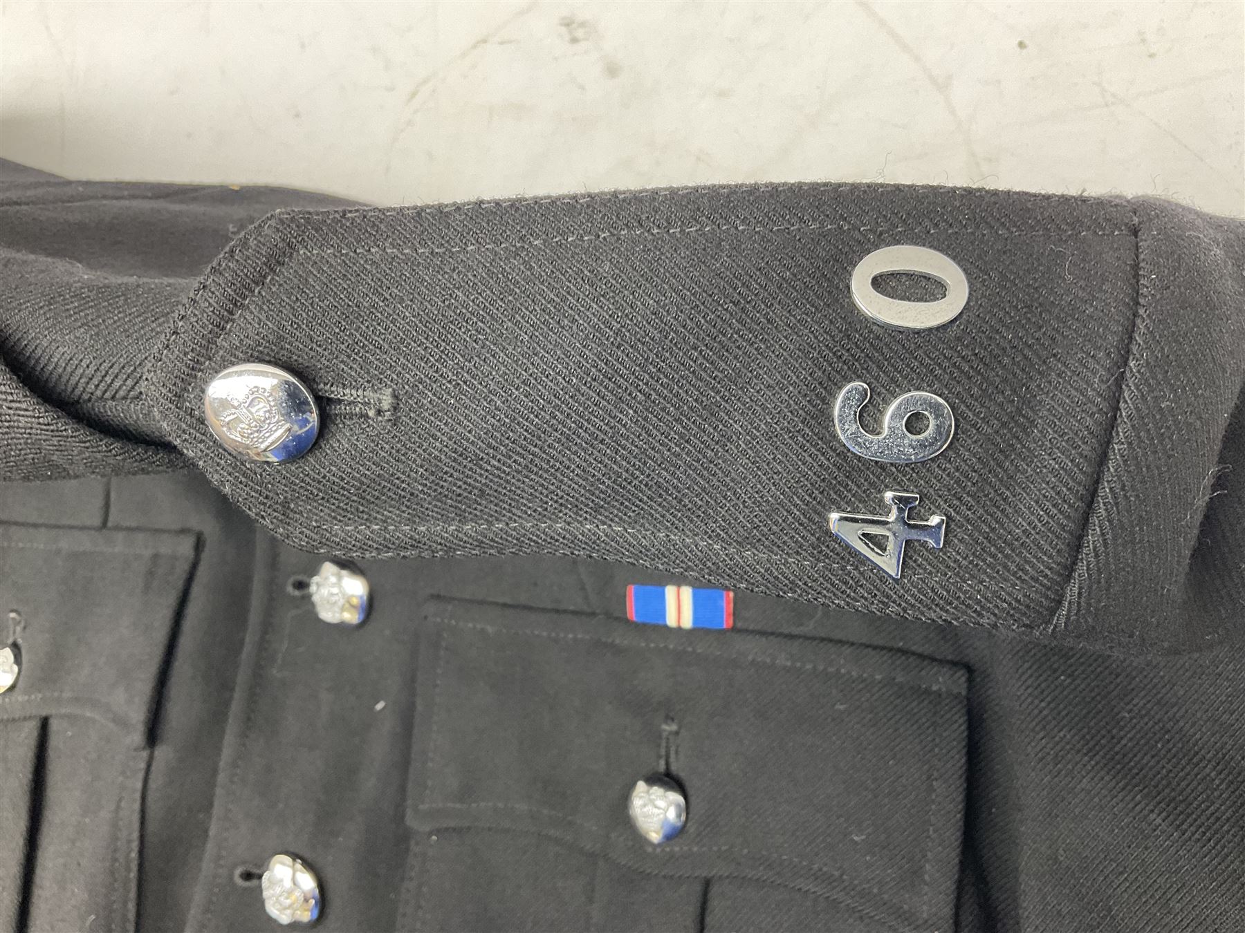 LNER Police cape; indistinctly dated 1943(?); York & North East Yorkshire Police belted tunic; belted tunic with Chief Constable epaulettes and buttons; and another tunic with staybrite Queens Crown buttons (4)