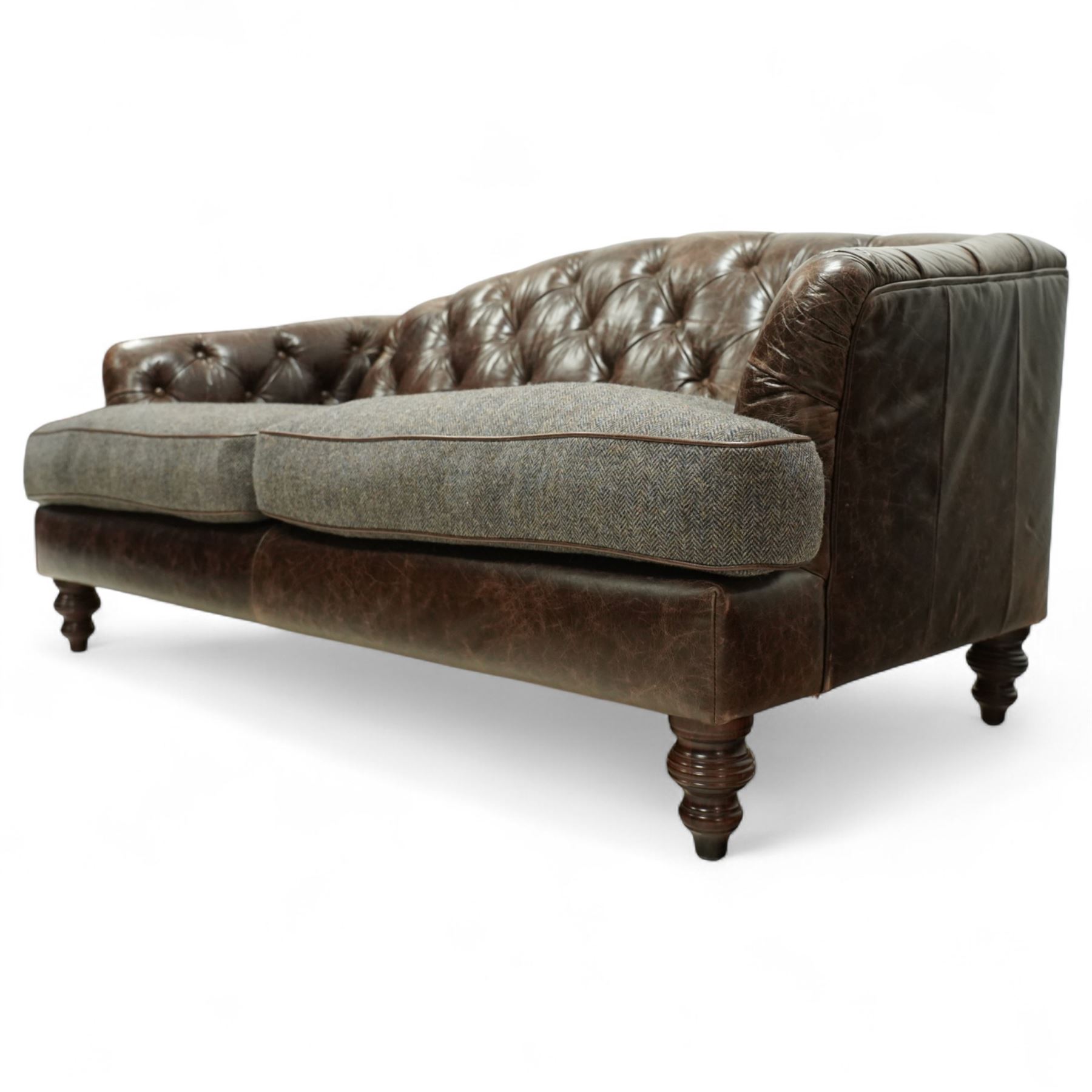 Tetrad - Harris Tweed and leather upholstered Chesterfield sofa, curved back and arms  with deep buttoned brown leather upholstery above loose herringbone tweed seat cushions with brown leather piping, raised on turned wooden feet 
