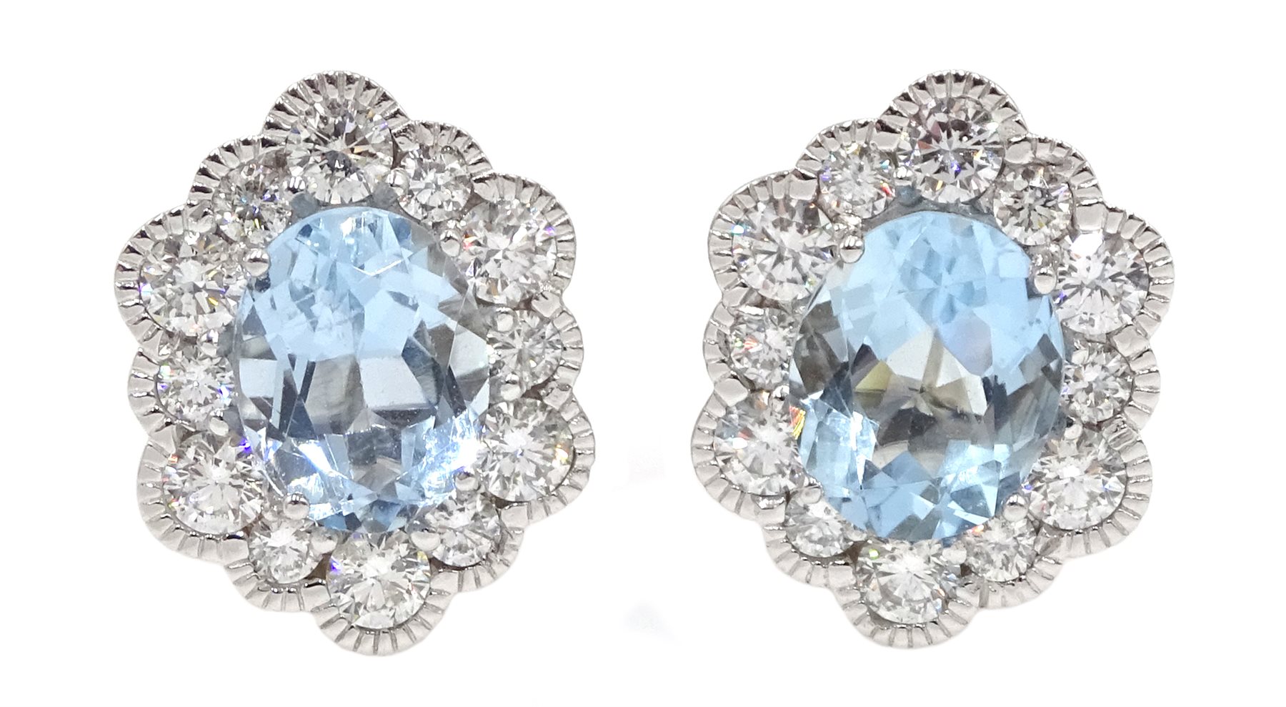 Pair of 18ct white gold oval aquamarine and diamond cluster stud earrings, hallmarked, total aquamarine weight approx 2.50 carat, total diamond weight approx 0.75 carat