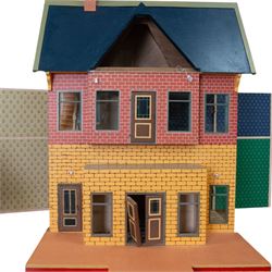 Moritz Gottschalk three storey wooden dolls house model 3589, with two side openings, with blue roof, painted exterior and wallpapered and painted interior, similar example featured in 'The Genius of Moritz Gottschalk' book, page 57, including chimney H100cm