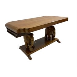 Hardwood coffee table on carved elephant figure supports, platform base on sledge feet