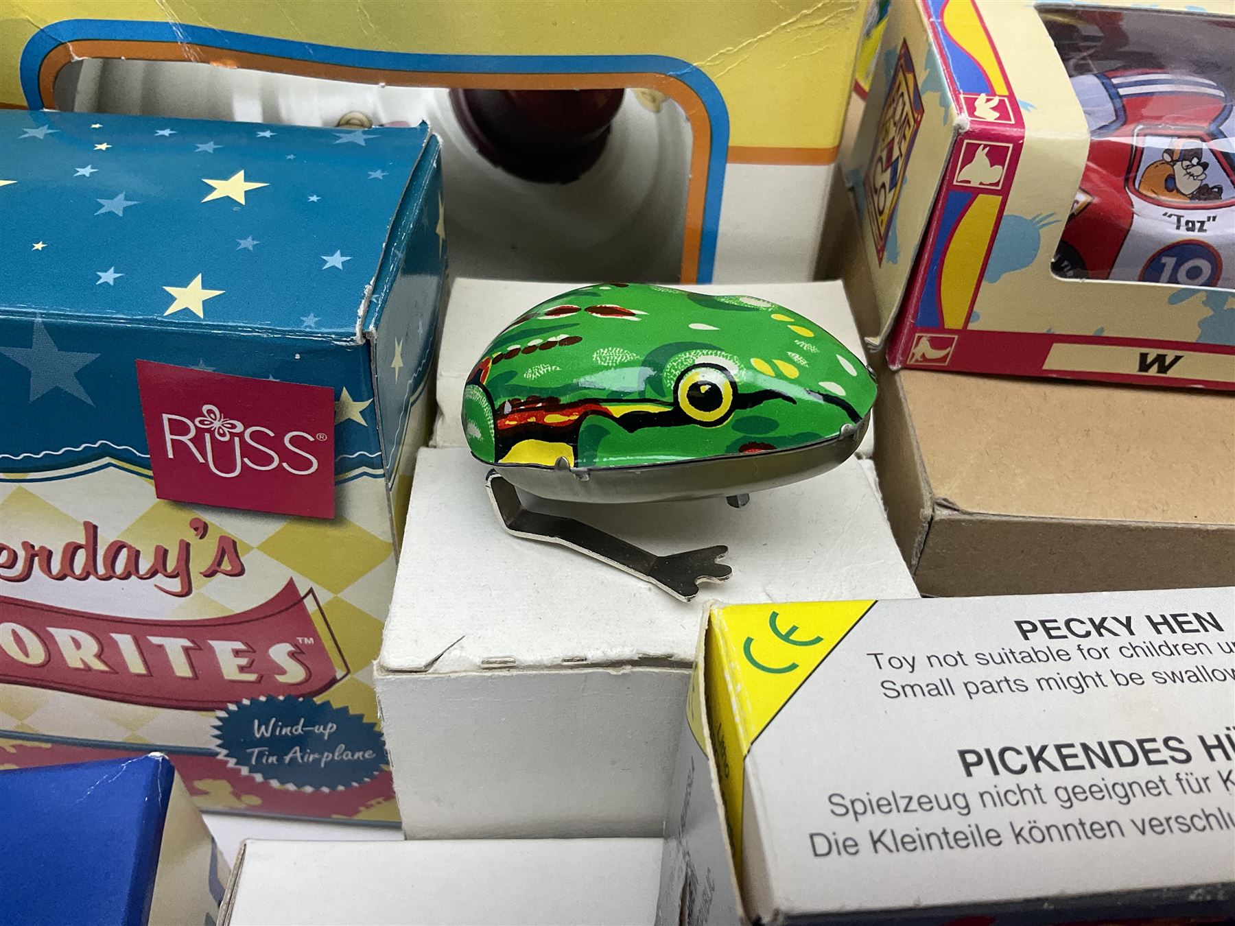 Twenty six tinplate models to include Ferris Wheel and Performing Circus Elephant, marked JW, further similar examples such as Duck on a Bike, Clown on Roller, Carousel; Popeye Tin Speedboat; Looney Tunes Wind Up Cars and Express Train; various international examples, MS107 Jumping Bambi, Pop Pop Boat, jumping frogs, pecking chickens etc; both boxed and loose