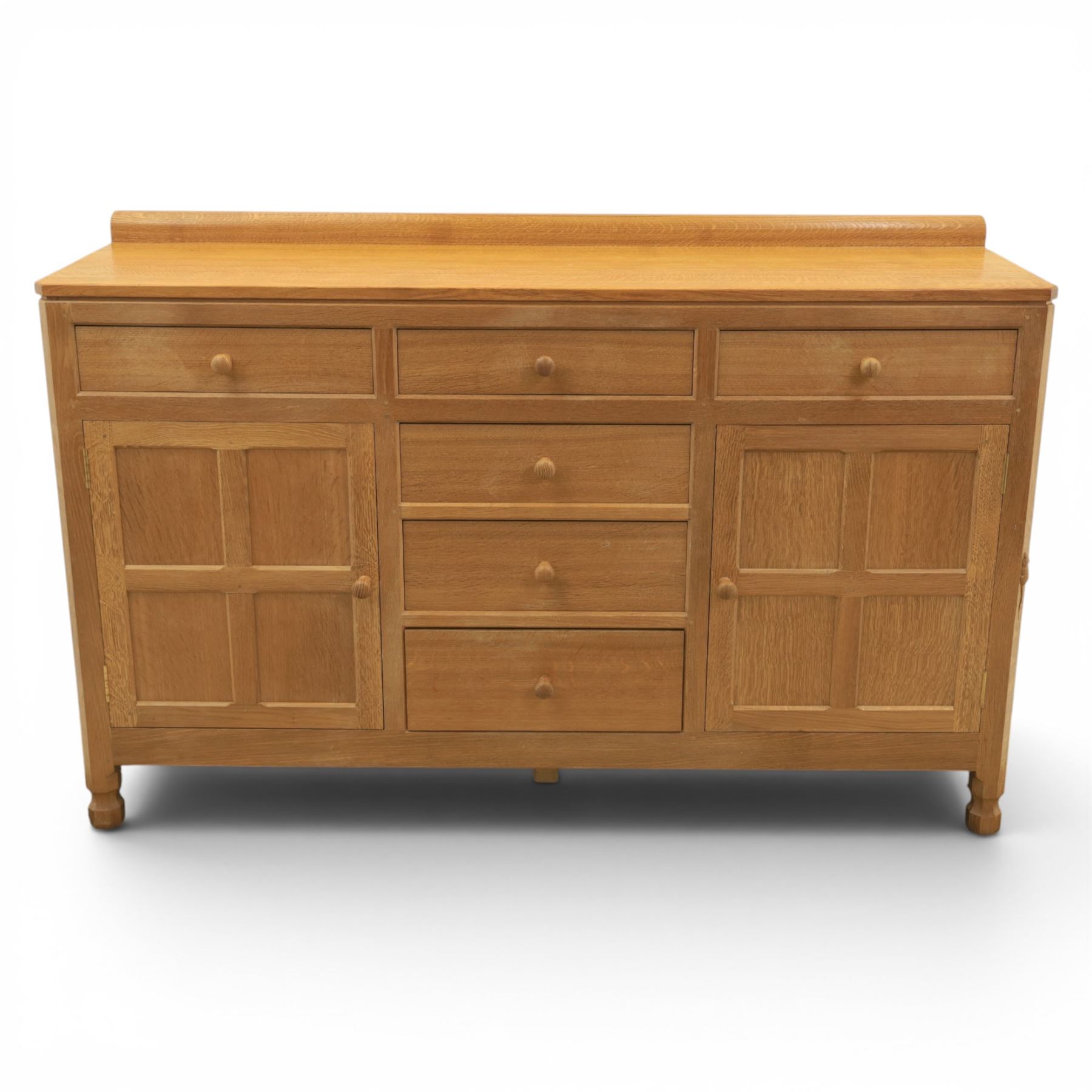 Mouseman - adzed oak dresser, fitted with six drawer and two cupboards, with carved mouse signature, by the workshop of Robert Thompson of Kilburn