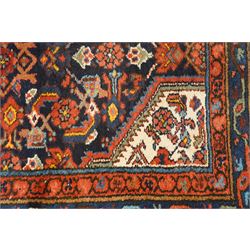 Large vintage Persian Hamadan indigo ground runner rug, the busy field with central ivory medallion and spandrels, surrounded with Herati motifs and stylised plant symbols, with multiple floral decorated guard bands