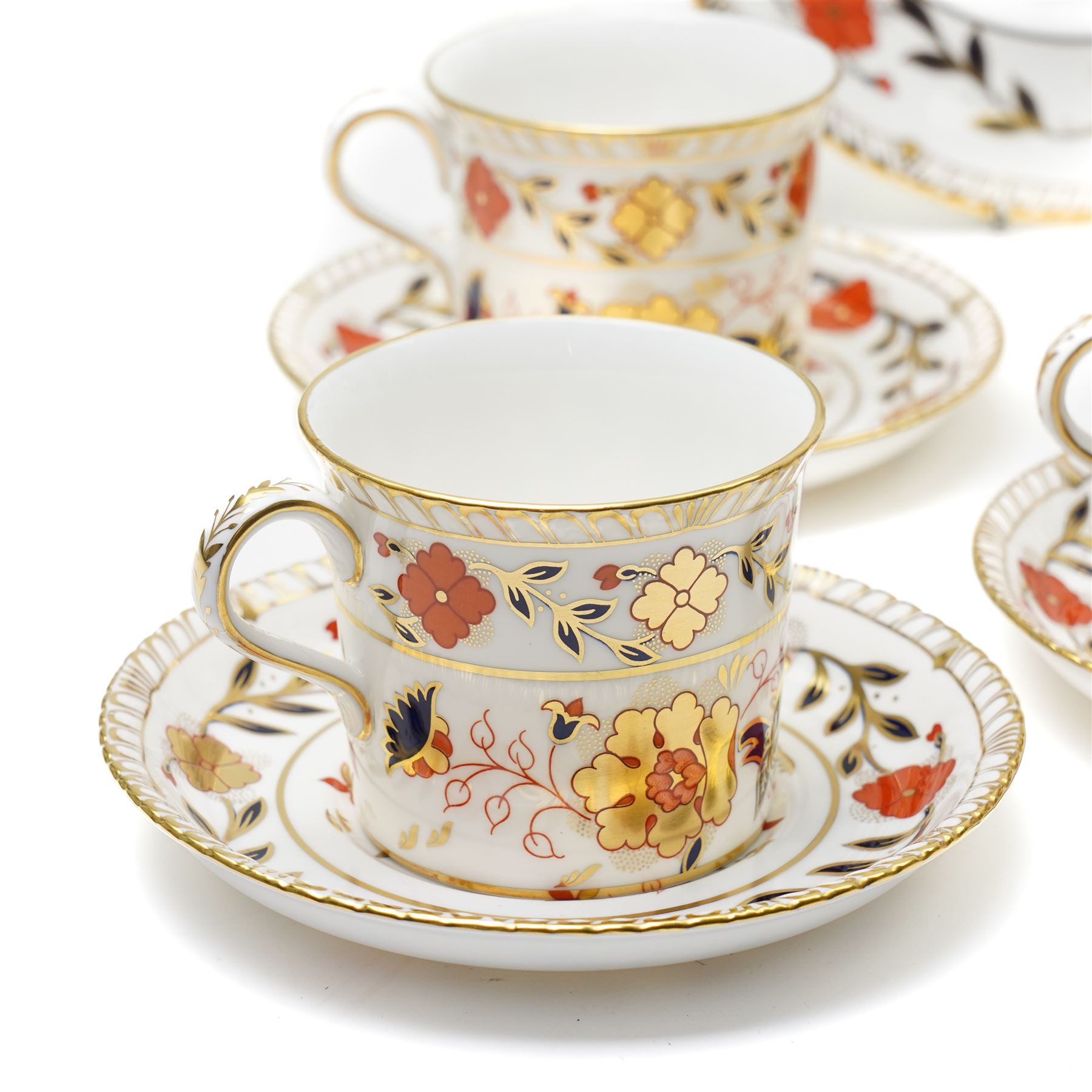 Royal Crown Derby 'Asian Rose' pattern A.962 tea service, comprising tea and coffee pots, open sucrier, milk jug, eight cups and saucers, six side plates, two serving plates, and a boxed Duck with gold stopper
