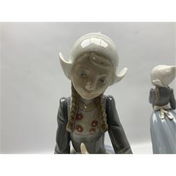 Three Lladro figures, comprising Dutch Girl with Braids no 5063, Dutch Girl with Duck no 5066 and Aracely with Ducks, all with original boxes, largest example H25cm