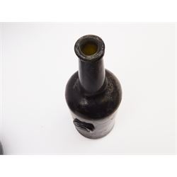 18th century green glass bottle, of onion form, H15cm, together with an 18th century green glass wine bottle, with seal depicting a boar beneath a crown, probably the Edgcumbe Crest, H27cm