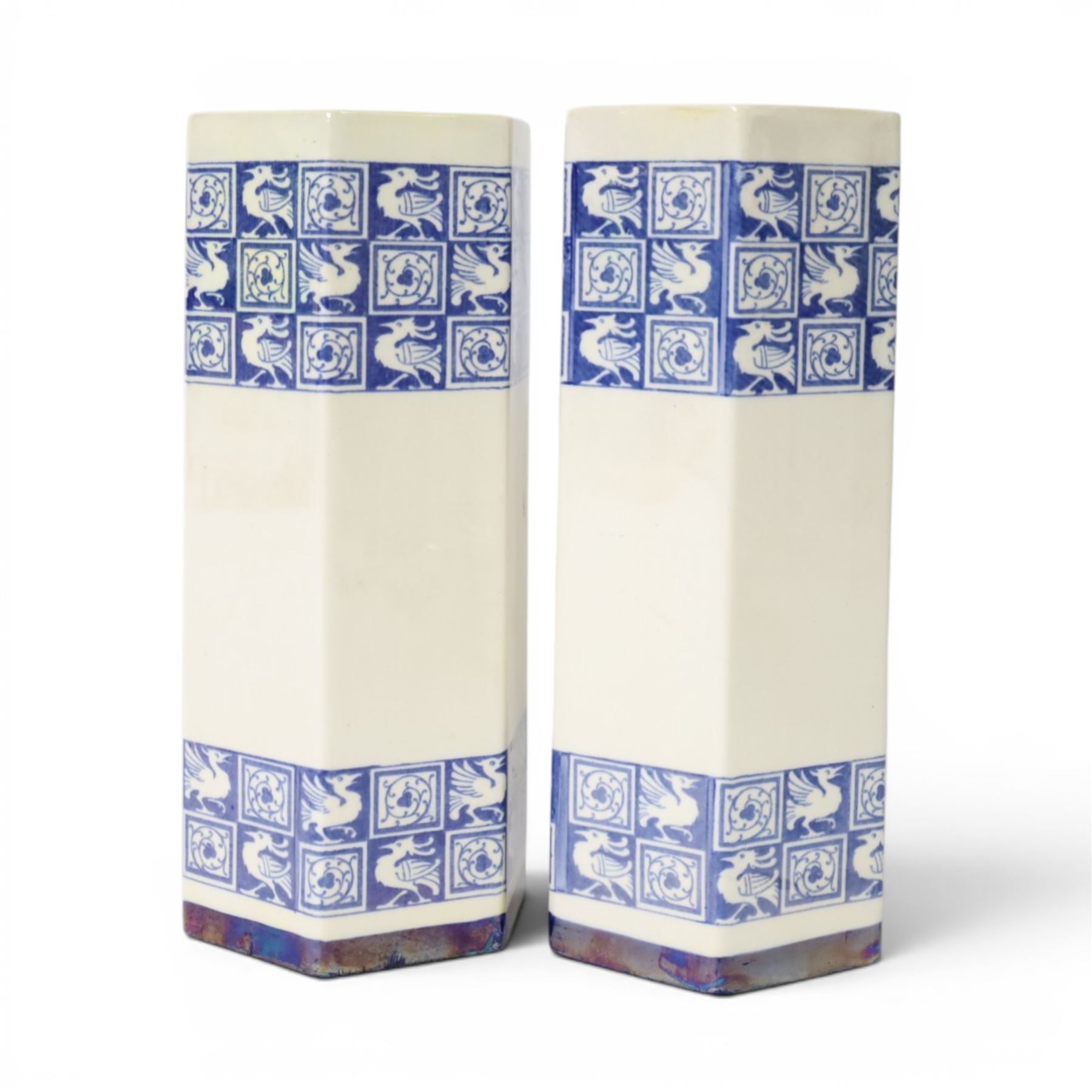 Pair of 1920's Art Deco Royal Doulton lustreware hexagonal vases, with boards of checkerboard design of alternating bird and scroll motifs, designed by Reco Capey, H28cm