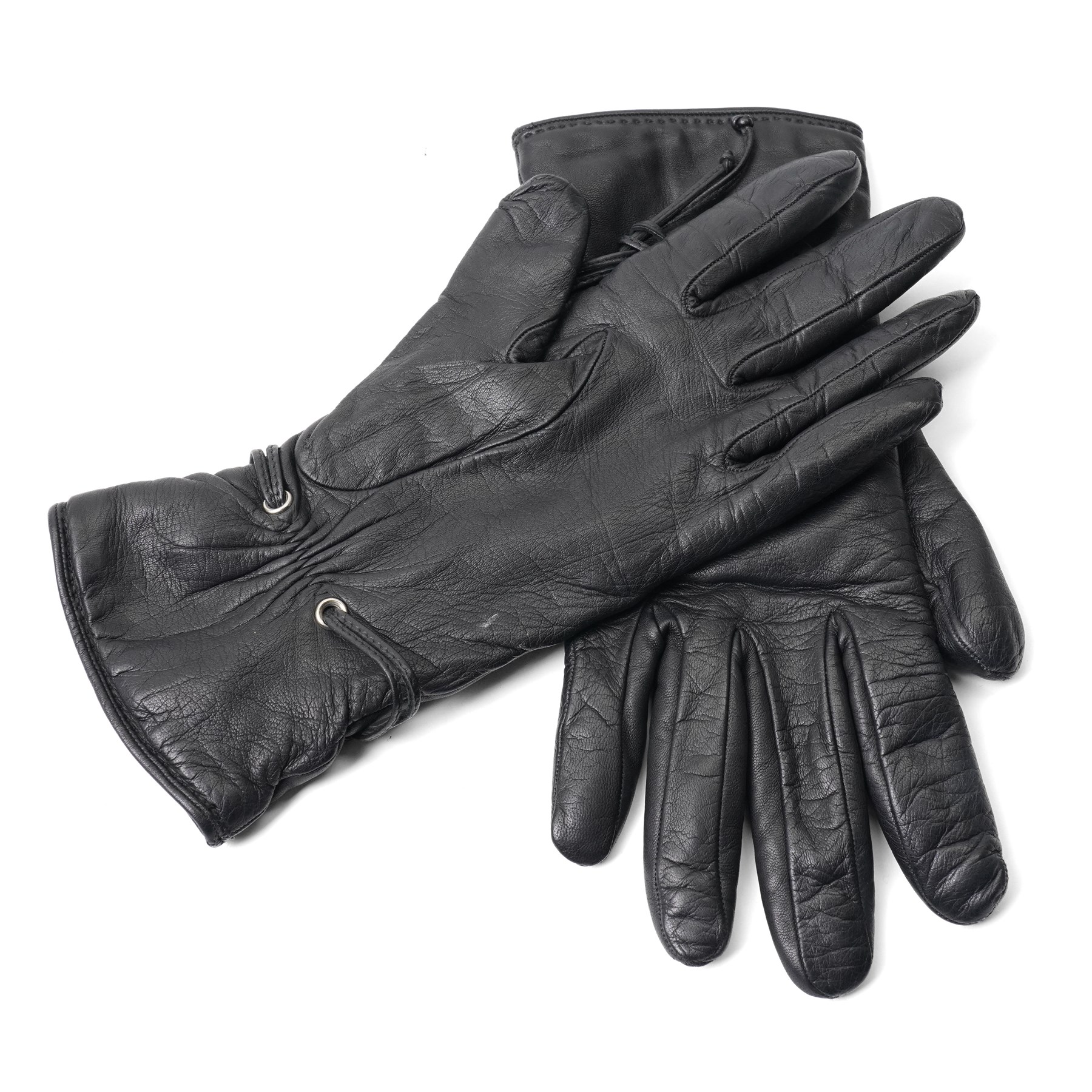 Hermès - pair of black leather gloves, lined in 100% cashmere, with pierced oval leather strap detail to cuffs, size 8