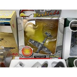 Fourteen die-cast models of aircraft including four Oxford Aviation, two Military Giants of the Sky, two Ixo Models, Corgi Warbirds Messerschmitt, Atlas Editions Spitfire and Messerschmitt, two Hobby Master etc; and two die-cast models of tanks; all boxed (16)