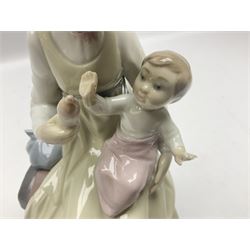 Lladro figure, Feeding Her Son, modelled as a mother bottle feeding her baby boy, sculpted by Vincente Martinez, with original box, no 5140, year issued 1982, year retired 1991, H23cm