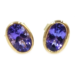  Pair of 9ct gold (tested) oval tanzanite stud earrings,   