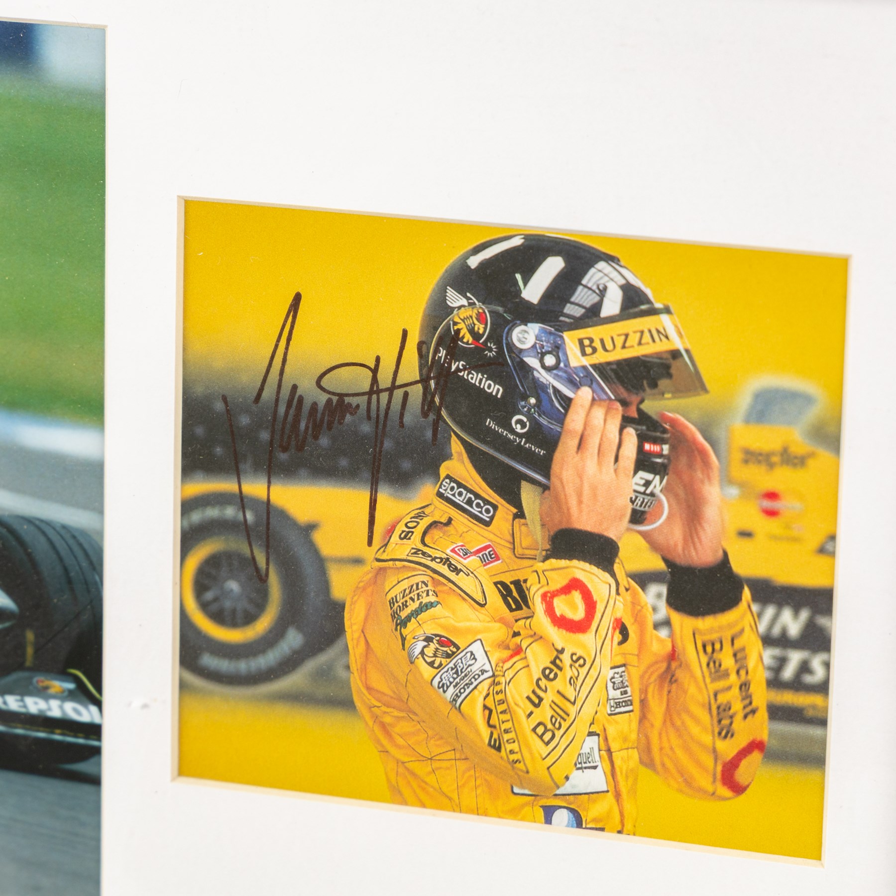 Ten signed Formula 1 photographs, comprising eight Damon Hill examples, Jenson Button and a Nigel Mansell example, nine with certificates of authenticity from Write Stuff Autographs, all framed, largest H47cm, W67cm