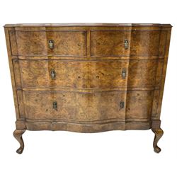 Early to mid-20th century figured walnut serpentine chest, moulded top over two short and two long cock-beaded drawers, fitted with drop handles in the form of shields with three recumbent lions, on cabriole feet