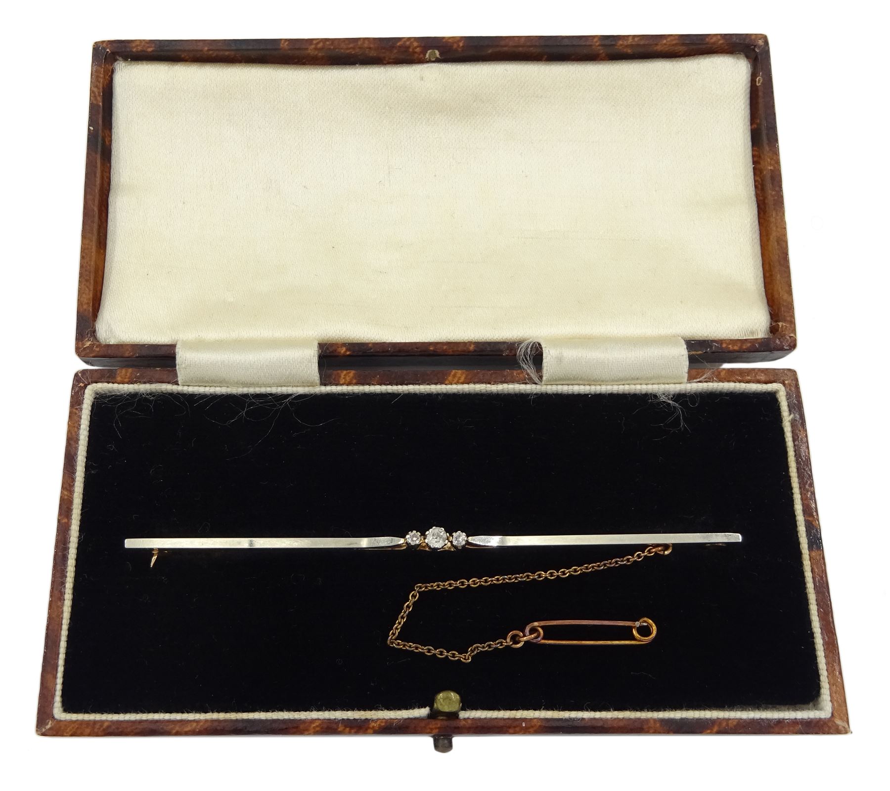 9ct gold bar three stone round brilliant cut diamond bar brooch, stamped and in fitted box 