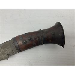 Kukri with 35.5cm engraved curving blade, steel mounted studded hardwood grip and engraved flat butt plate L46cm overall (no scabbard); and a Burmese Dha with 56.5cm slightly curving blade and copper mounted hardwood grip; in wooden scabbard L80cm overall (2)