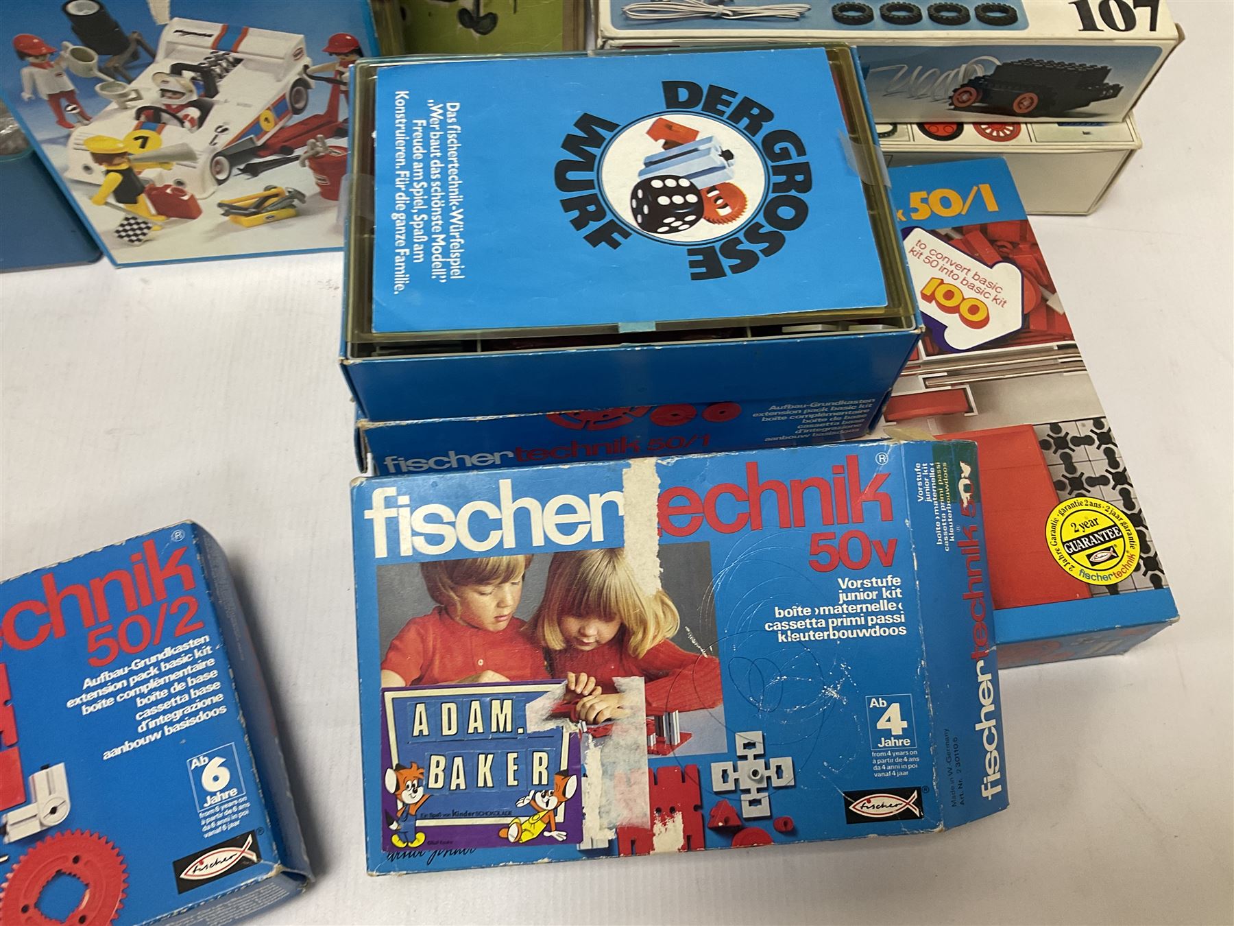 Fischer Technik/Lego/Playmobil - thirteen model building sets comprising eight Fischer Technik sets 50, 50/1, 50v, 50/2, 50+mot1 and two 50S, 50/1 add-on pack, with spare parts packs 01, 03, 05, two 22 and 30; two Lego sets comprising C107 and Lego Systems 103, part-set 870 and 970; Playmobil no.3520 set; four boxes of loose lego, various instruction manuals and a scrapbook 