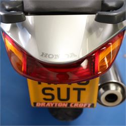 1998 Honda VFR800 FI Sports Touring Motorcycle

• Registration: R145 SUT
• Date of first registration: 1998
• Engine: 781cc V4 petrol
• Fuel system: Honda PGM-FI fuel injection
• Transmission: Manual
• Odometer reading: 11,700 miles
• Colour: Silver with black trim
• V5C: Present
• Keys: Two
• Security: Datatag immobiliser

A well-presented 1998 Honda VFR800 FI sports touring motorcycle, finished in silver with contrasting black trim and displaying a notably low odometer reading of 11,700 miles.

The VFR800 combines Honda’s renowned V4 engine with PGM-FI fuel injection and a combined braking system, creating a capable and refined motorcycle suited to both sporting and long-distance use.

Features include:

• Full factory fairing
• Tinted windscreen
• Honda PGM-FI fuel injection
• Combined braking system
• Twin front brake discs
• Factory exhaust system
• Alloy wheels
• Rear passenger grab handles
• Datatag immobiliser
• Digital instrument display

The motorcycle appears complete and largely original and has been stored indoors. It is presented in good overall condition, with light cosmetic marks consistent with its age and use.

This vehicle forms part of the Estate of the Late John Sils and is offered for sale by the Executors, confirming a genuine reason for sale.
