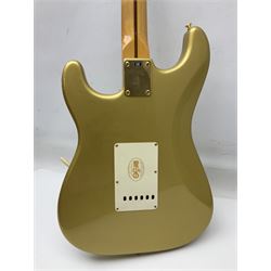 Fender Stratocaster 50th Anniversary 2004 metallic gold electric guitar; serial no.MZ4116369; L98cm; in Spider fitted case with owners manual and other paperwork, strap and belt buckle etc