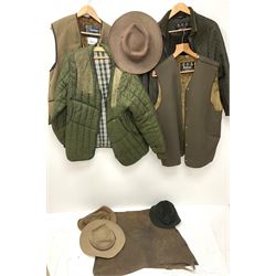 A ladies Barbour quilted dark green jacket, size 14, together with a further Barbour green quilted jacket, no size label, two Barbour 'pile lining' gilets/jacket inserts, two Barbour hats, three Akubra 'pure fur felt' hats, etc. 