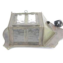 Early 20th century Arts and Crafts metal wall light or lantern, the projecting centre with three glass panels, the central panel opening on hinges, surmounted by a pointed top, upon a shaped back panel, overall H38.5cm D11cm W28cm 
