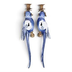 Pair of wall sconces, modelled as blue parrot upon a gilt branch, H47cm