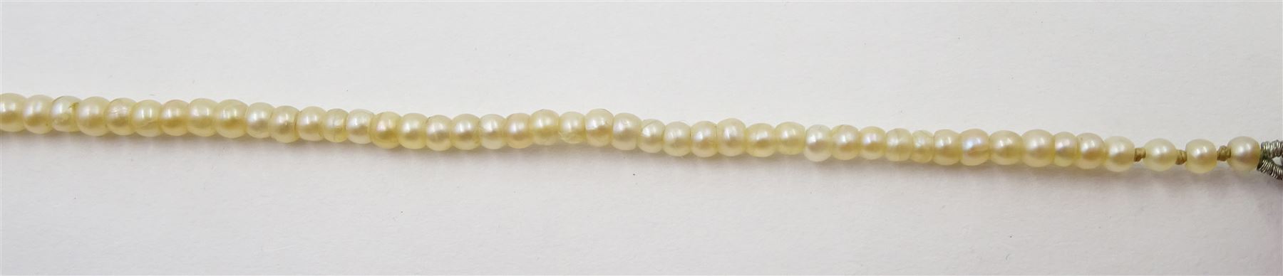 Three strand pearl necklace, with platinum diamond milgrain clasp and a single strand graduating pearl necklace with 18ct white gold clasp set with a diamond