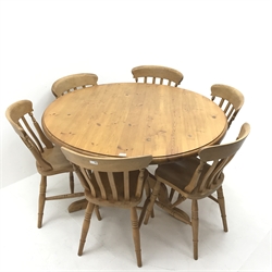 Solid circular pine table, turned column on three supports (D128cm, H76cm) and set six beech farmhouse style dining chairs (W38cm)