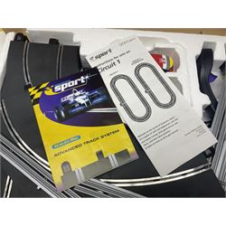 Scalextric - Formula One set with McLaren Mercedes and Williams BMW cars; and Speed Extreme set with Ford Focus cars; both boxed with accessories and paperwork; and Parker Pro-Action football game; boxed (3)