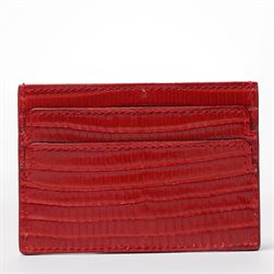 Alexander McQueen - a leather card holder in red lizard-effect leather, with multiple card slots and silver-tone skull motif to the front, unused, 7cm x 10cm