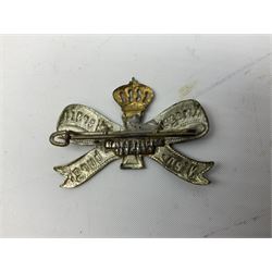 Two WW2 German Army Afrika Korps pith helmet metal side badges; RAD oval metal badge by J.B.u.Co.; WW1 German 1914-1915 bar brooch; and Nienburg War Veteren's Association badge (5)