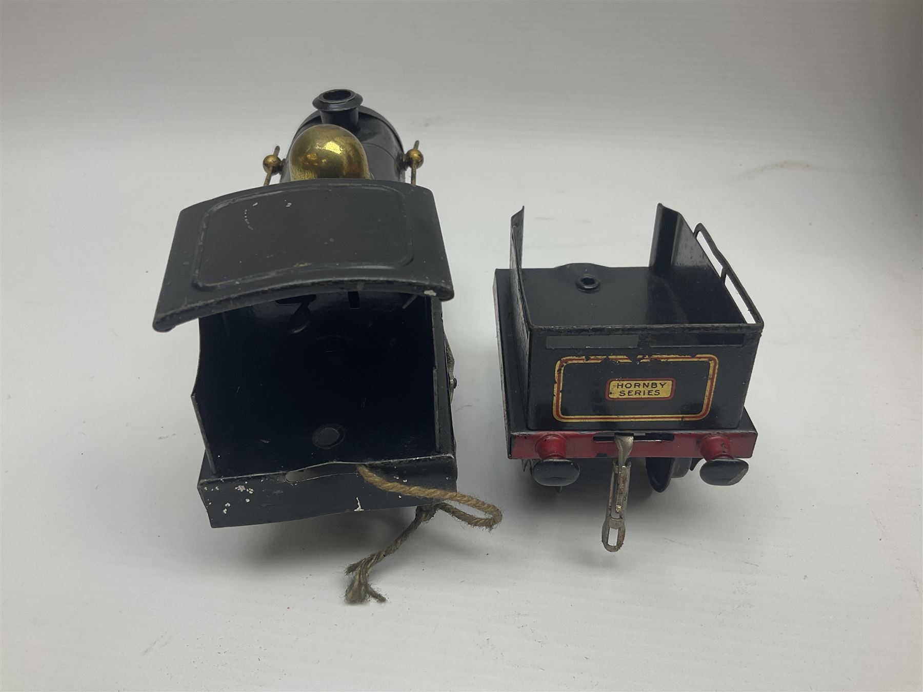 Hornby ‘0’ gauge - No. 0 Goods Set box containing clockwork LNER 0-4-0 locomotive with matching tender no.2710 in black and gold, originally from the No. 1 Goods Set; with NE open wagon, quantity of track, track clips, buffer and key 