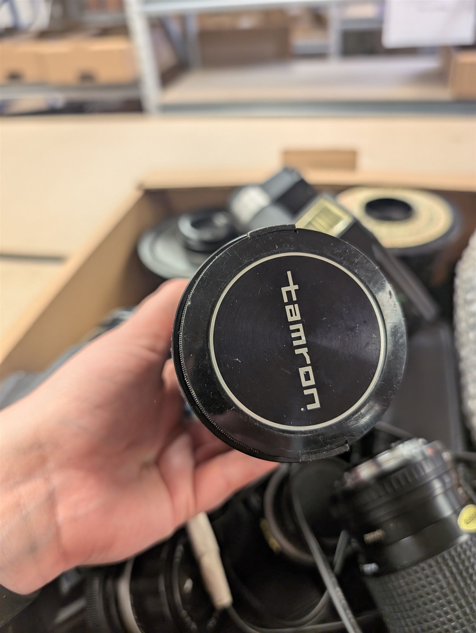 Collection of camera lenses, including Tamron, Praktica, Minolta and Soligor examples