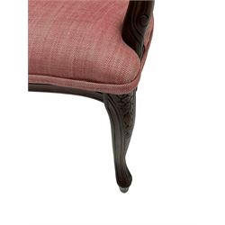 French style stained beech two seat settee, the cresting rails carved with flower heads, mould arms with scrolled terminals, upholstered in pink herringbone fabric, floral carved cabriole supports
