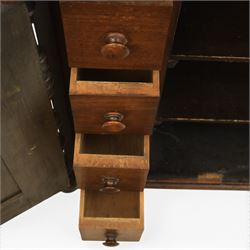 Victorian mahogany low cabinet, shaped rectangular top fitted with two arch panelled doors flanked by turned pilasters, enclosing two shelves and fitted with four short drawers with turned knobs 