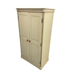 Painted double wardrobe, spiral turned design on cornice and uprights, two panelled doors enclosing shelf and hanging rail, in latte finish