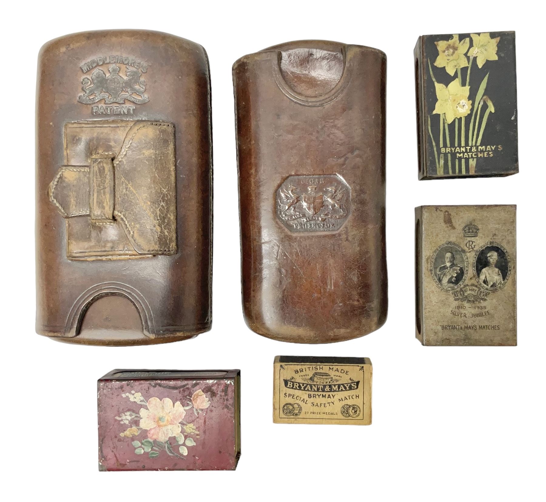 Victorian leather cigar protector with metal match striking plate on the end and internal spring to hold the cigars in place; expands for differing lengths of cigar, minimum L12.5cm; another similar leather cigar case marked Middlemore's Patent with attached vesta case and striker; three Bryant & Mays tin-late matchbox holders including 1935 Jubilee; and small box of matches (6)