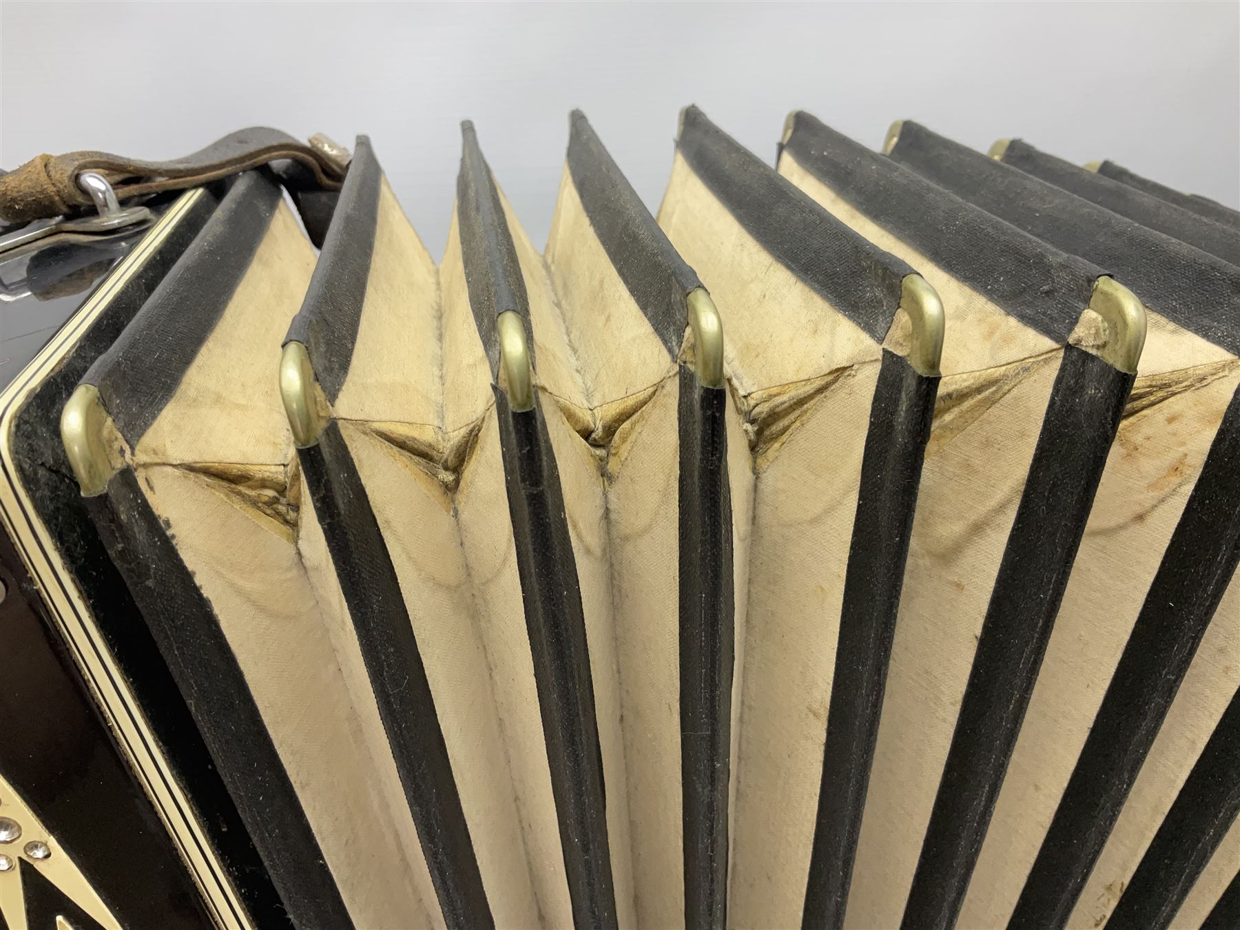 Scandalli Vibrante Three piano accordion in Art Deco black and white case with jewelled decoration, twenty-four keys and one-hundred and twenty buttons; inscribed '5700 Camerano Italia'; serial no.3414 L54cm; in carrying case with strap