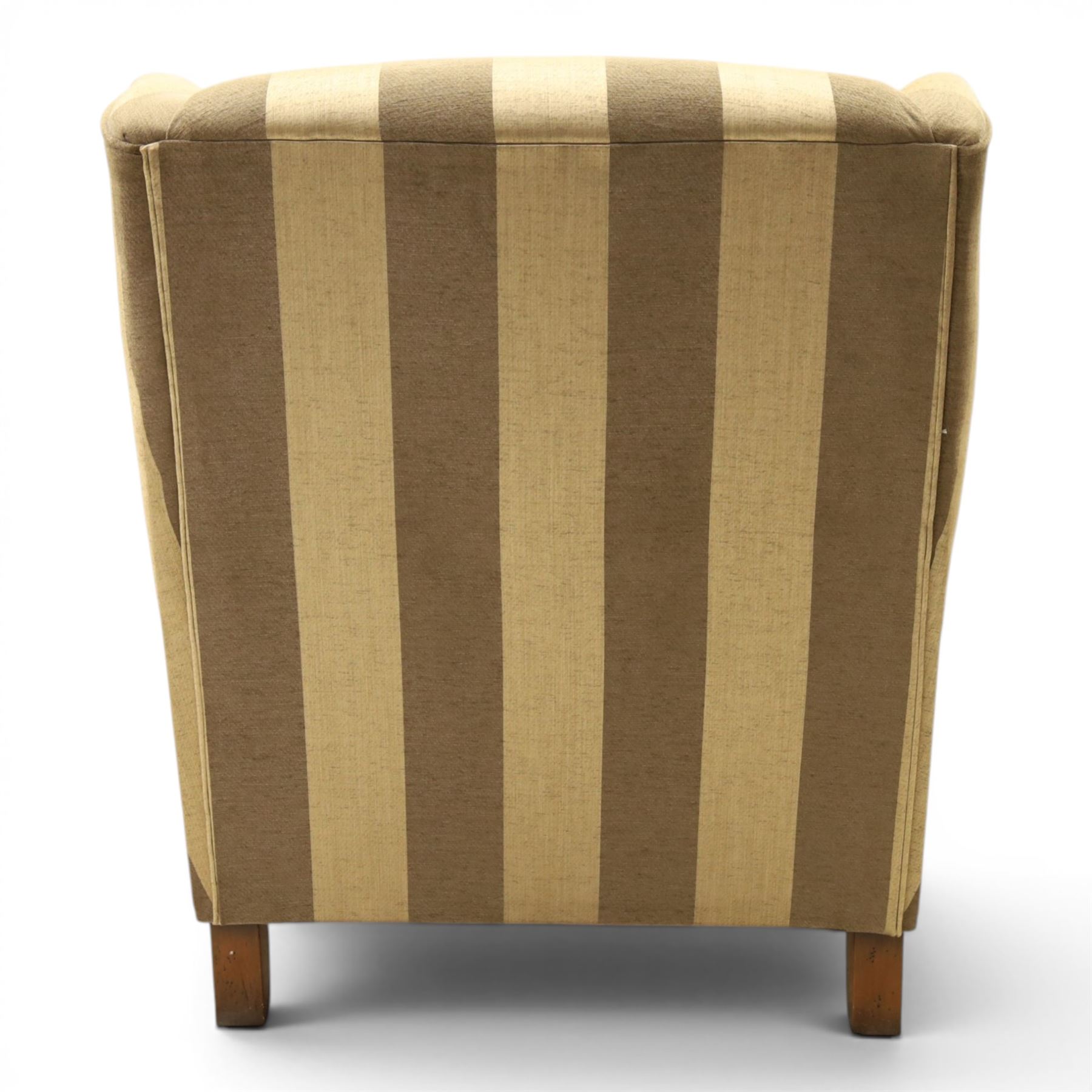 Alstons - 'Ixworth' armchair, upholstered in striped fabric, with loose seat cushions and scrolled arms, brass front castors