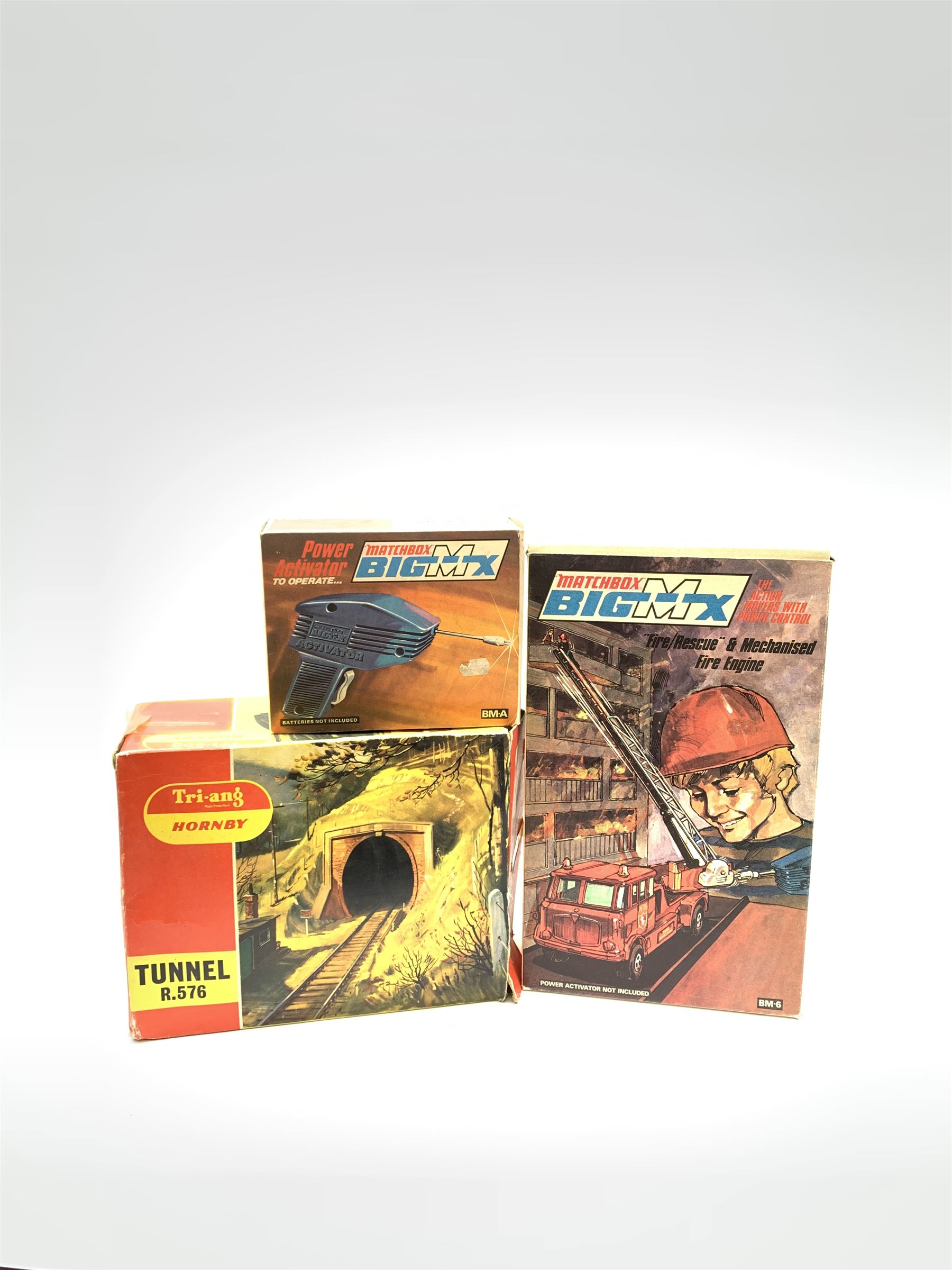 Matchbox Big MX Fire/Rescue and Mechanised Fire Engine No.BM-6; and Matchbox Big MX Power Activator; both boxed; together with a Tri-ang/Hornby '00' gauge model railway tunnel No.R576, boxed (3)