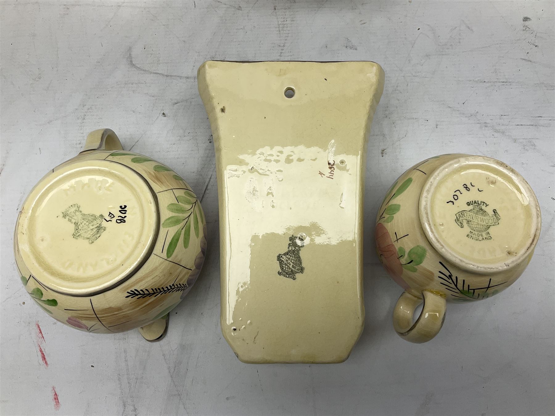 Collection of 1930s Art Deco Arthur Wood ceramics, decorated in floral pattern 3028, with silvered rims, to include pair of vases, basket, jugs, wall pocket etc, largest H22cm