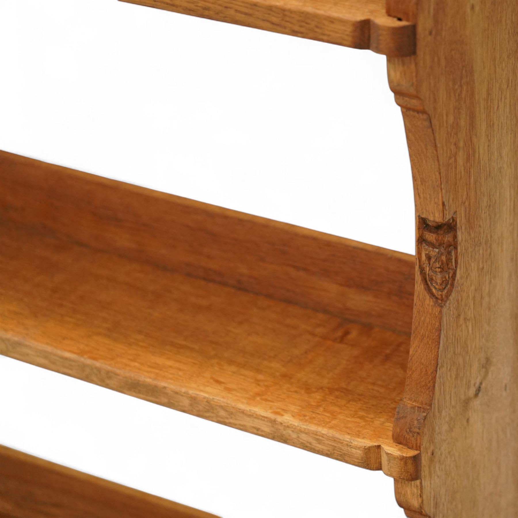 Gnomeman - oak plate rack, rectangular moulded top over three open plate shelves with raised front rails, shaped and chamfered upright supports, stepped base plinth, signature carved Gnome by Thomas Whittaker of Littlebeck