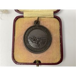 Collection of WW2 and police medals c.1933-1955, awarded to Eric Drinkwater comprising 1939-45 War Medal, Defence Medal, 1939-45 Star and Burma Star, on wearing bar; 1918-62 General Service Medal with Cyprus clasp to P.S. E.G. Drinkwater; boxed; Police Long Service and Good Conduct Medal to Const. Eric C. Drinkwater; cased; Royal Life Saving Society bronze medal to E.C. Drinkwater July 1933; boxed; and George V 1937 coronation medallion; boxed.