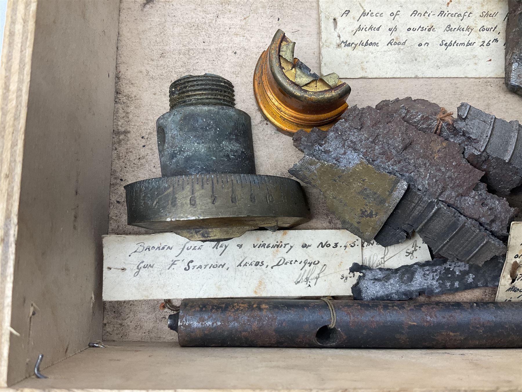 Small collection of WW2 shrapnel and German and British shell parts, most with manuscript details of where and when found including London, Leeds, Bristol, Linton-on-Ouse etc
