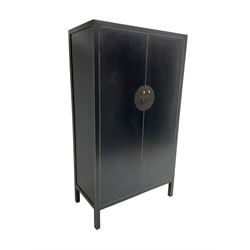 Chinese design black lacquered wardrobe, two cupboard doors enclosing hanging rail and two drawers